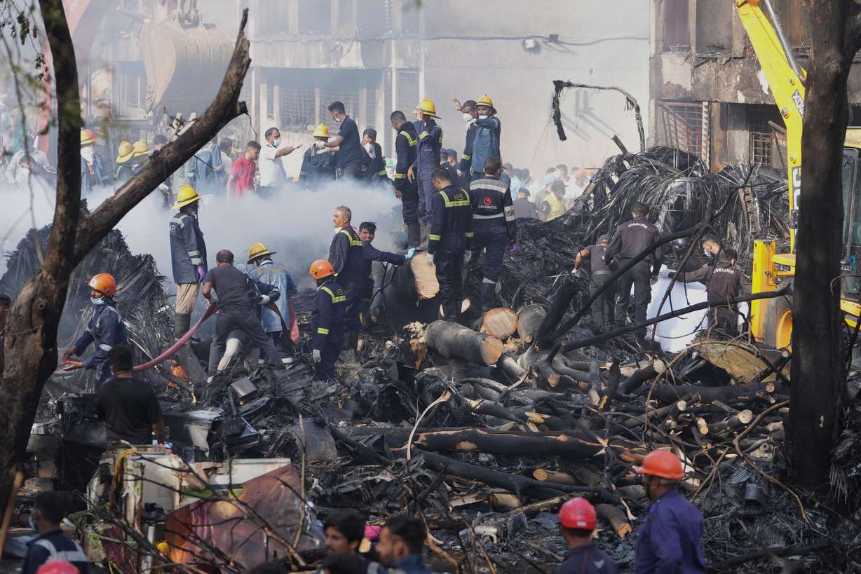Search and rescue teams respond to the scene of a plane crash in Ahmedabad, India, Thursday. Only one of the 242 passengers survived, while five medical students were killed when the plane struck a building.