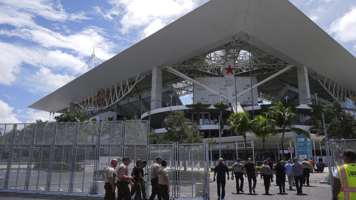 Law enforcement personnel walk outside Hard Rock Stadium during preparations for Saturday's opening match in the Club World Cup soccer tournament, Wednesday, June 11, 2025, in Miami Gardens, Fla.