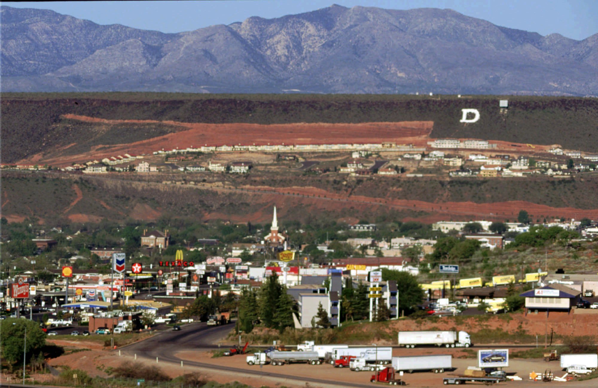 Homesites carved out of the cliffs overlooking St. George in April 1995. Since 1980, the city's population has climbed from 13,000 to over 104,000 in 2023.