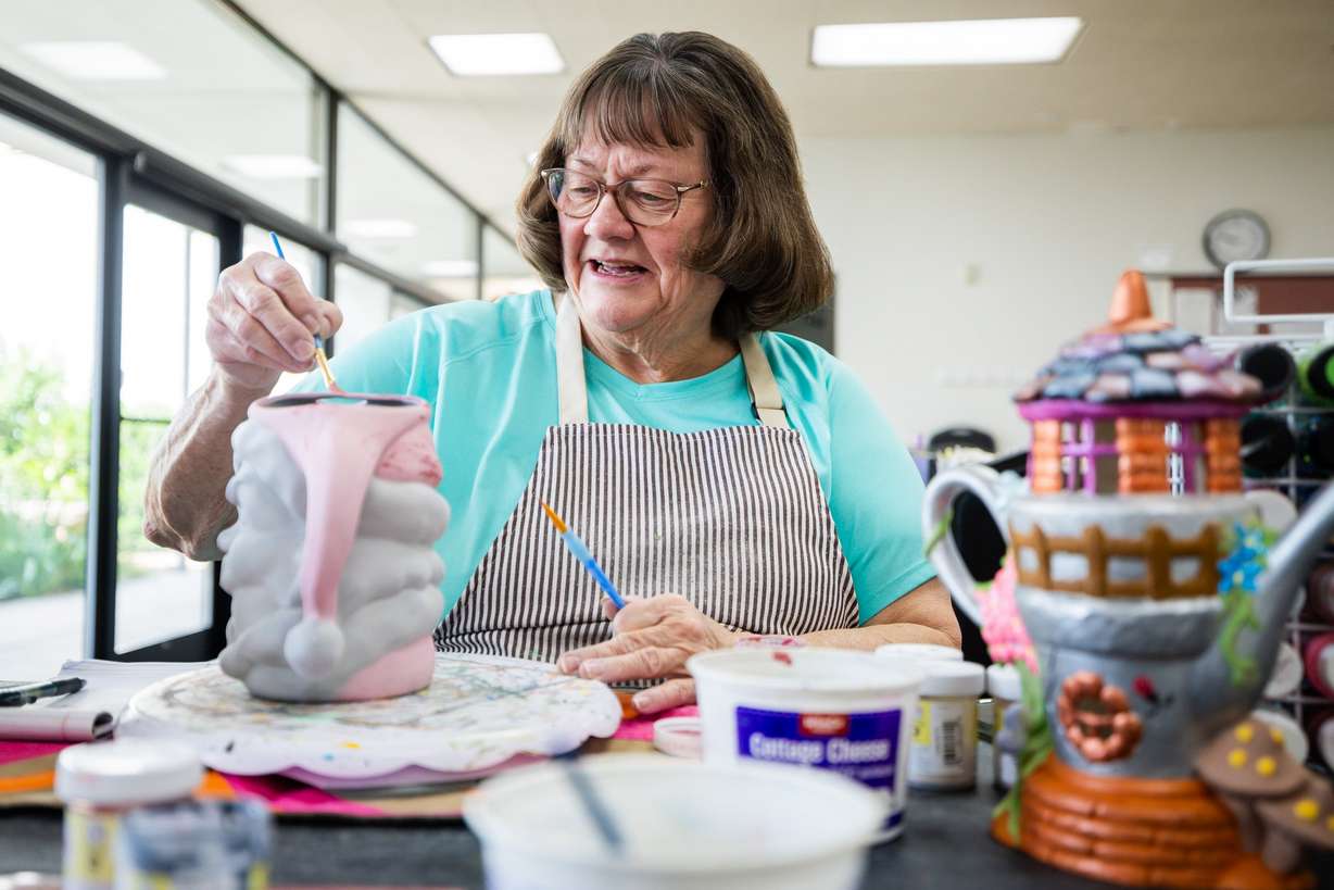Leslie Johnson during a senior ceramics class at the Murray City Senior Recreation Center on Thursday. The smiles in the class were an example of why Caring.com ranked Utah as the happiest state for seniors this week.