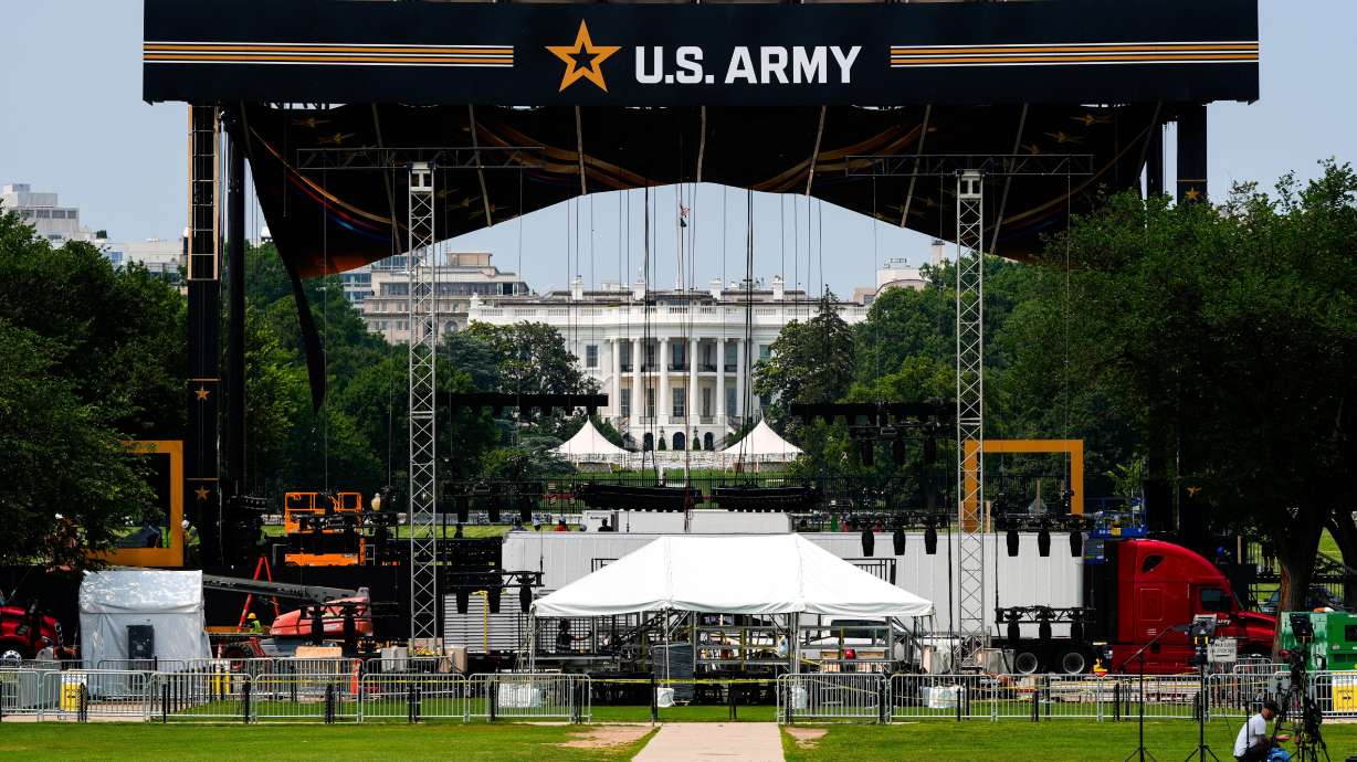 The White House is seen beyond a stage ahead of an upcoming military parade, June 11 in Washington. Saturday is Flag Day.