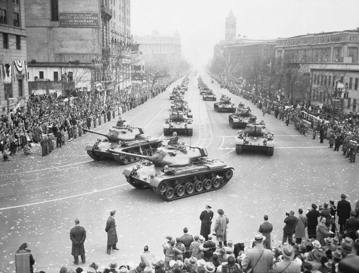 Army medium tanks move along Pennsylvania Avenue during the Inaugural Parade for President Dwight D. Eisenhower, Jan. 21, 1953, in Washington. Front tanks are turning onto 15th Street on the way to the reviewing stand set up in front of the White House.