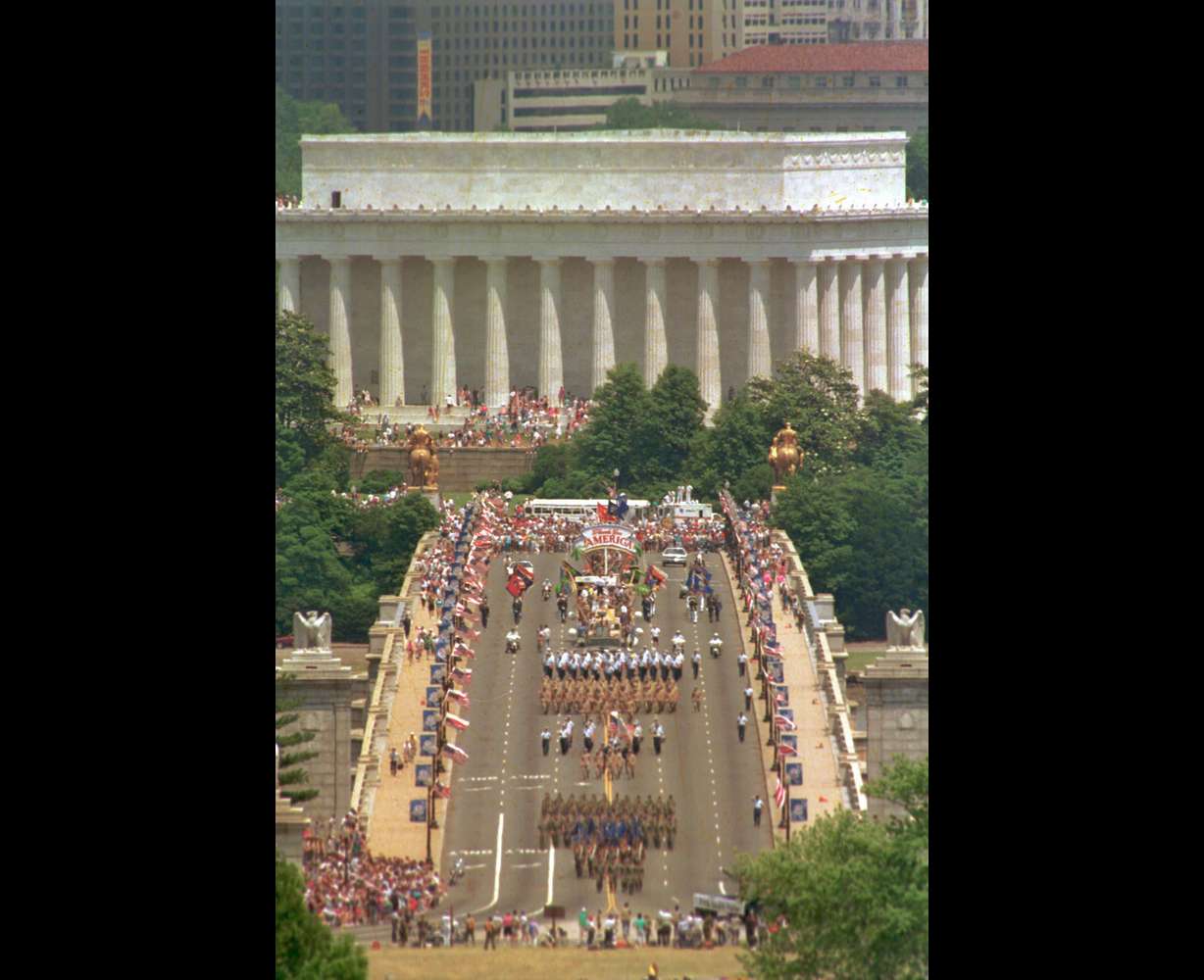 This view, taken from Arlington National Cemetery, shows troops marching across the Memorial Bridge, with the Lincoln Memorial in the background, in Washington, heading toward the Pentagon during the National Victory Day Parade, June 8, 1991. The celebration to honor Gulf War troops drew an estimated 800,000 spectators.