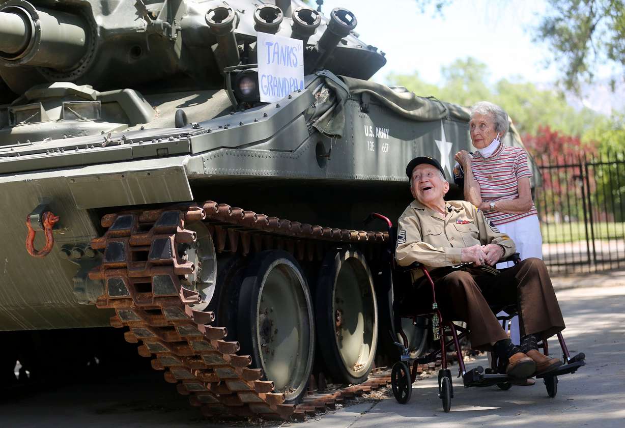 Army Master Sgt. Mark Heyrend, a 102-year-old World War II veteran, and his wife, Donna, look at a “Tanks Grandpa” sign while visiting the Fort Douglas Military Museum with family in Salt Lake City on June 24, 2020. Heyrend served in the Army from 1942-1945 and worked as a stenographer clerk for Gen. George Patton.
