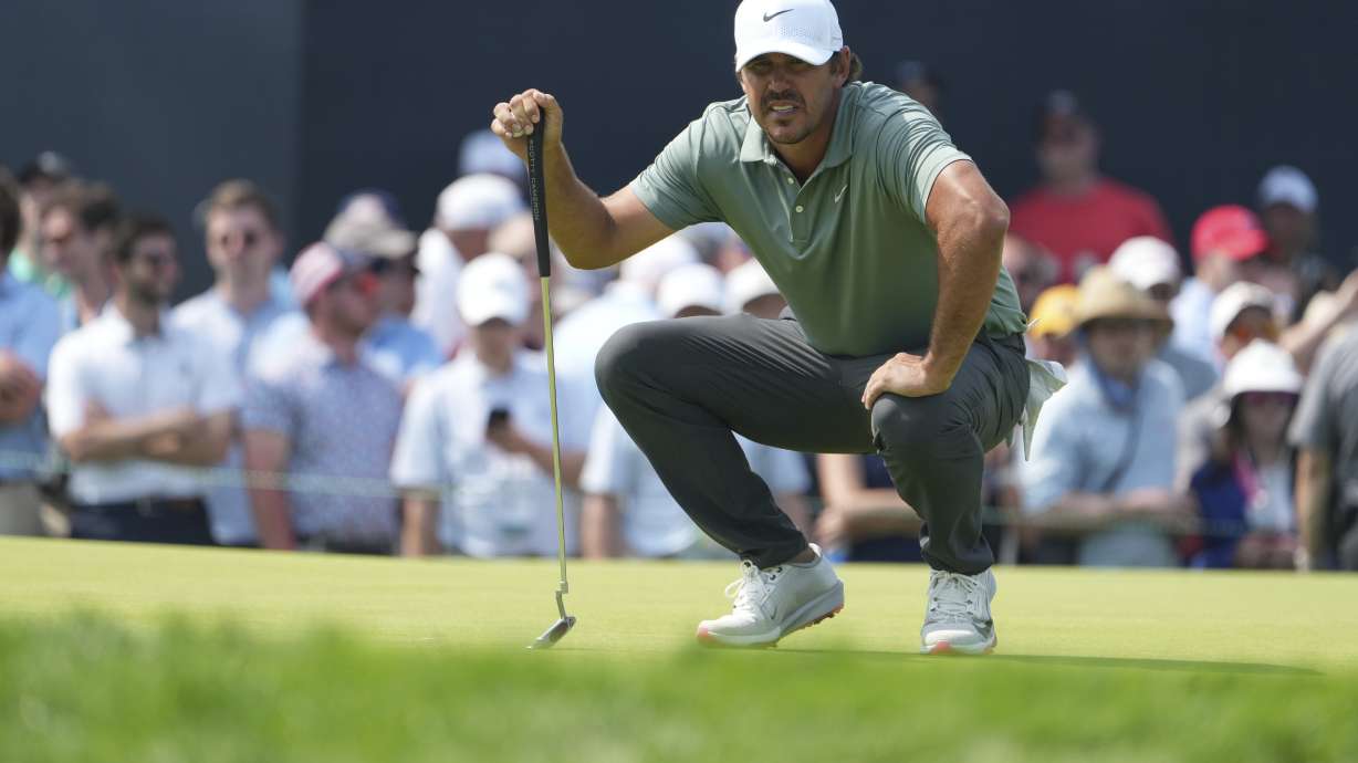 Brooks Koepka lines up a putt on the ninth hole during the first round of the U.S. Open golf tournament at Oakmont Country Club Thursday, June 12, 2025, in Oakmont, Pa.