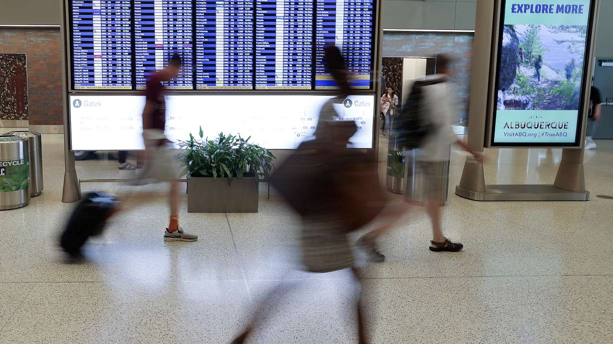 Travelers move through the Salt Lake City International Airport in Salt Lake City on June 12, 2025. A legislative audit report released on Tuesday sheds light on a 2024 cyberattack at the airport and changes made since then.