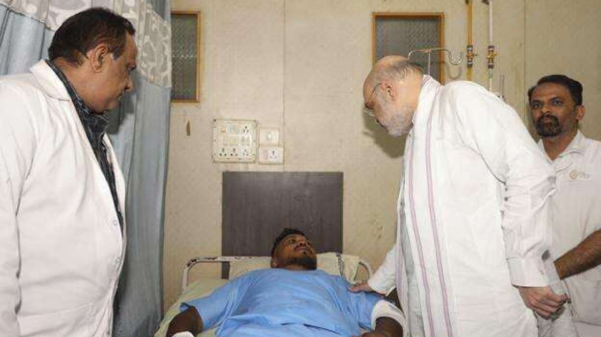 Home Affairs Minister Amit Shah meets British plane crash survivor Vishwash Kumar Ramesh, 40, at a hospital in Ahmedabad, Friday.