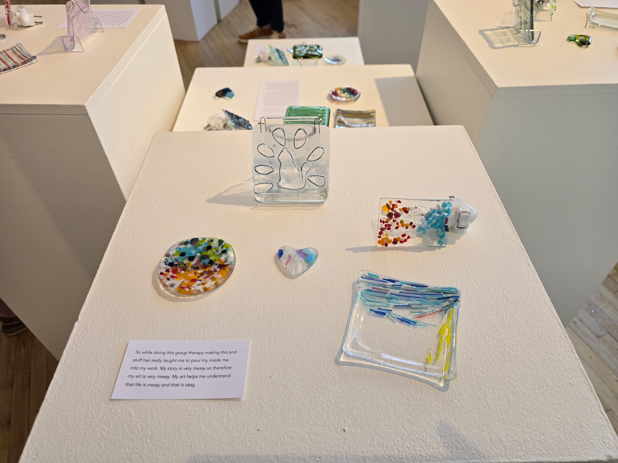 The Fragments to Wholeness Art Show showcases glass artworks created by a group of 11 teenage sexual assault survivors.