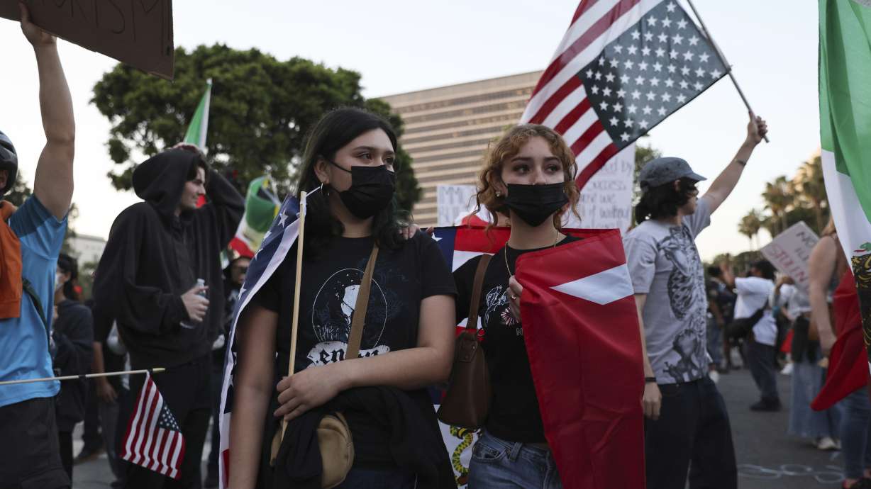 Protesters rally during a demonstration in response to a series of United States Immigration and Customs Enforcement (ICE) raids throughout the country, in Los Angeles, Calif., Thursday, June 12, 2025.