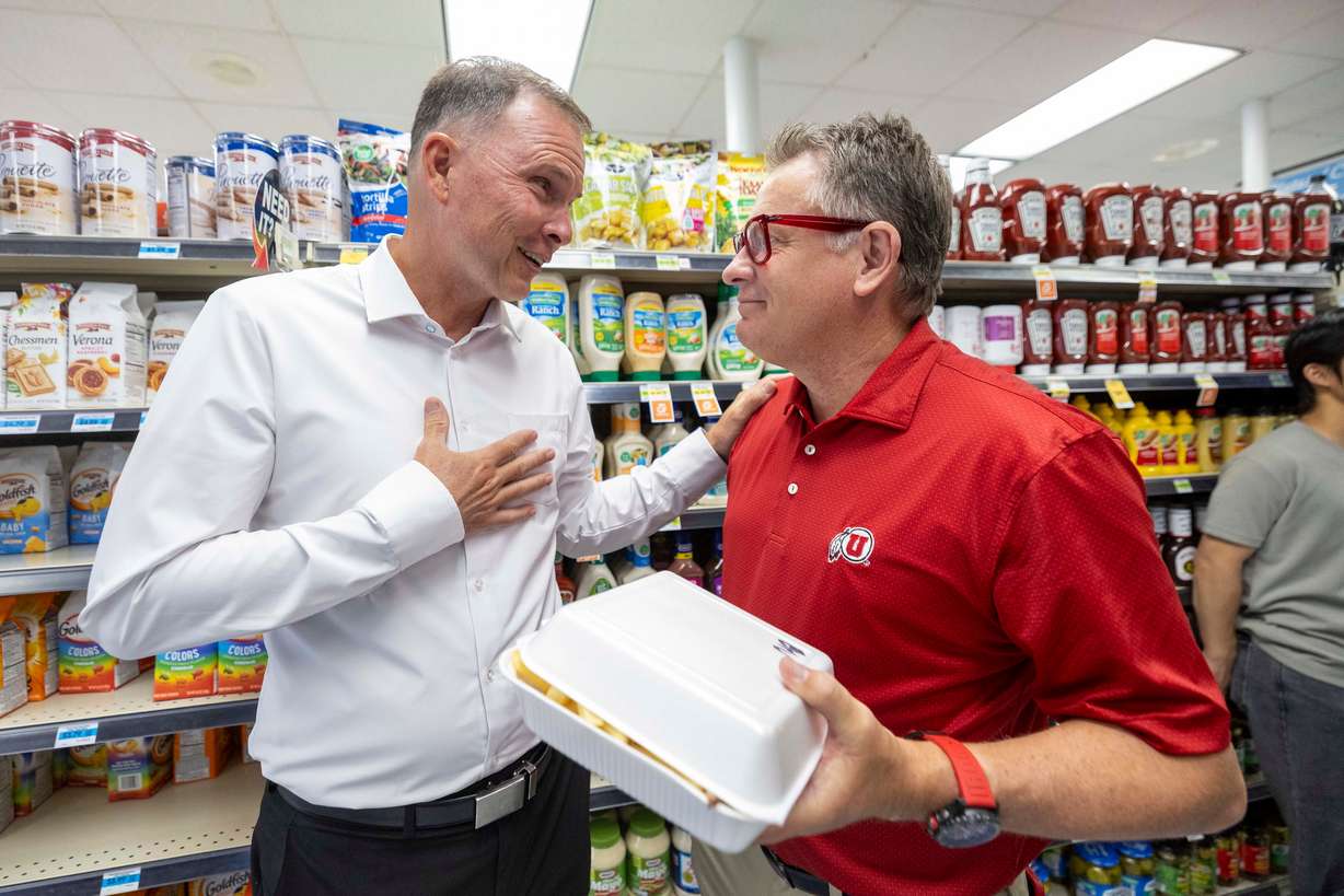 University of Utah President Taylor Randall talks with BYU Administrative Vice President Steve Hafen during a visit at the BYU Creamery in Provo on Friday.