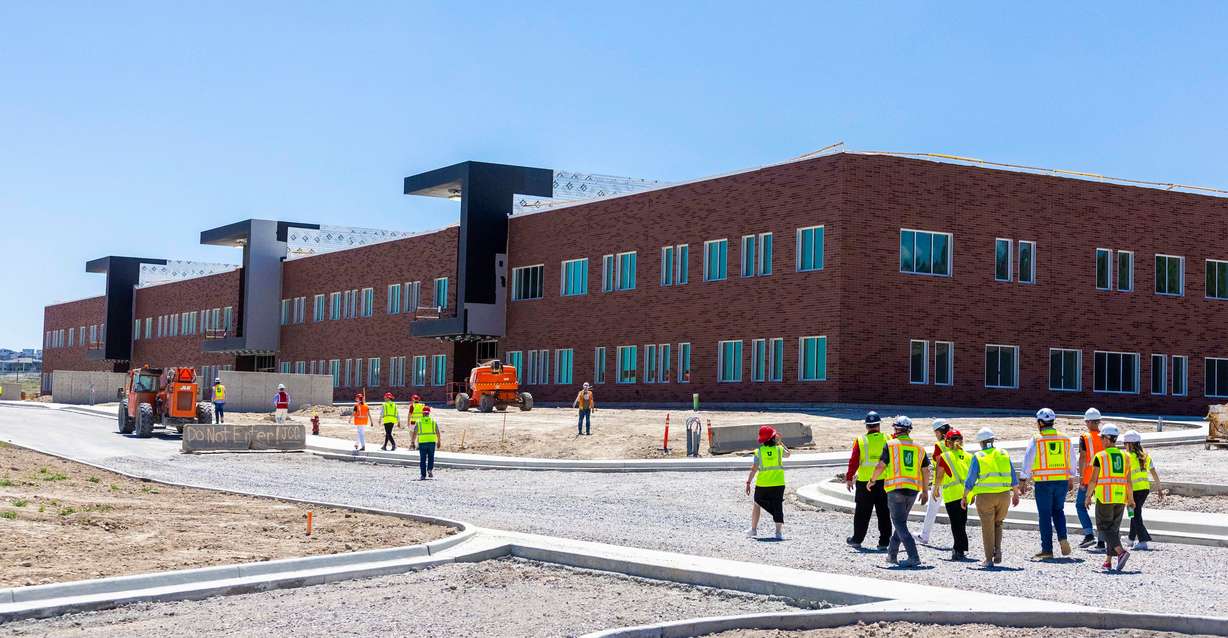 University of Utah President Taylor Randall and other university leaders tour the Camp Williams project site in Bluffdale on Friday.