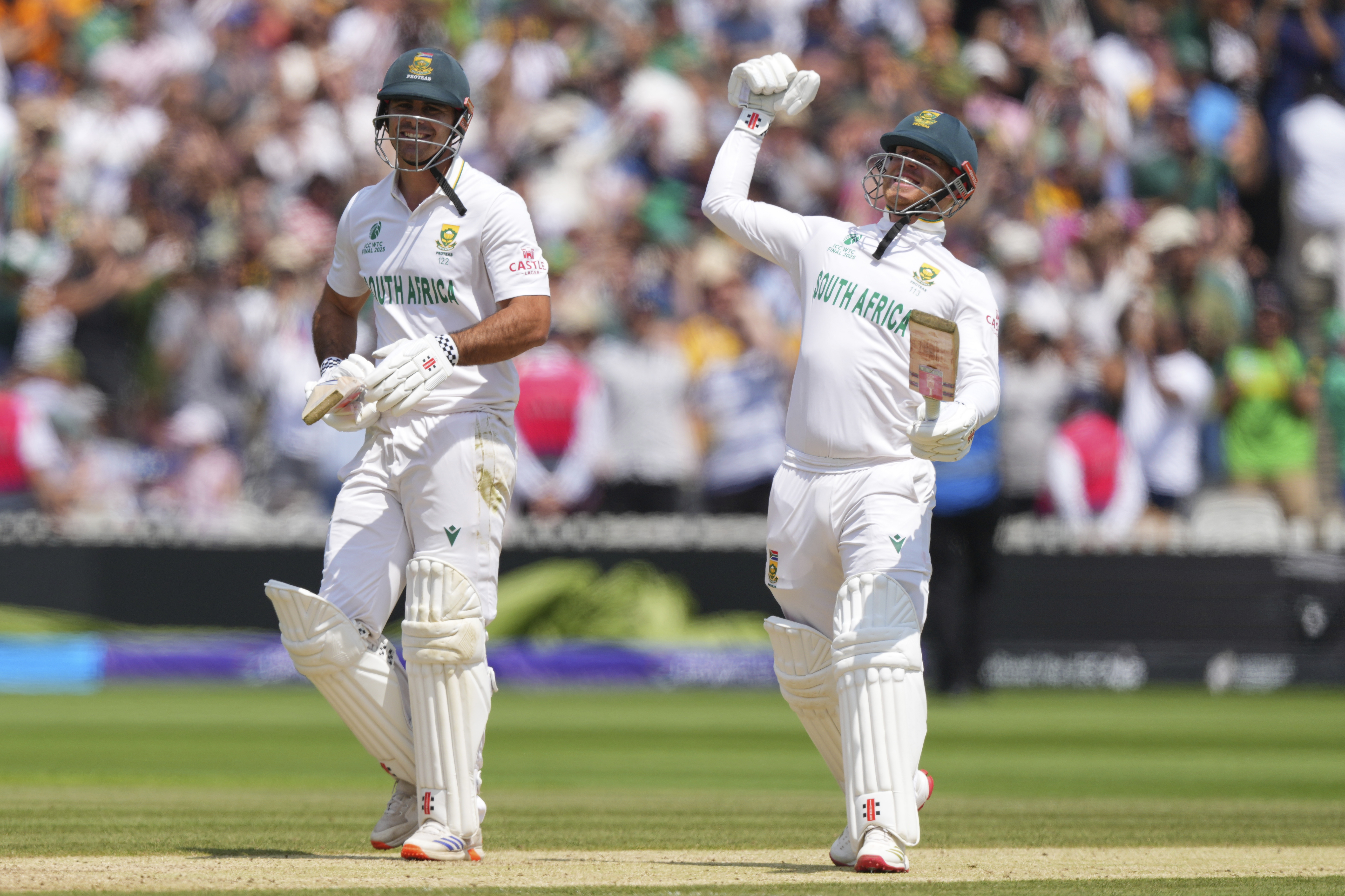 South Africa's David Bedingham, left, and Kyle Verreynne celebrate after their win in the World Test Championship final against Australia at Lord's cricket ground in London, Saturday, June 14, 2025.