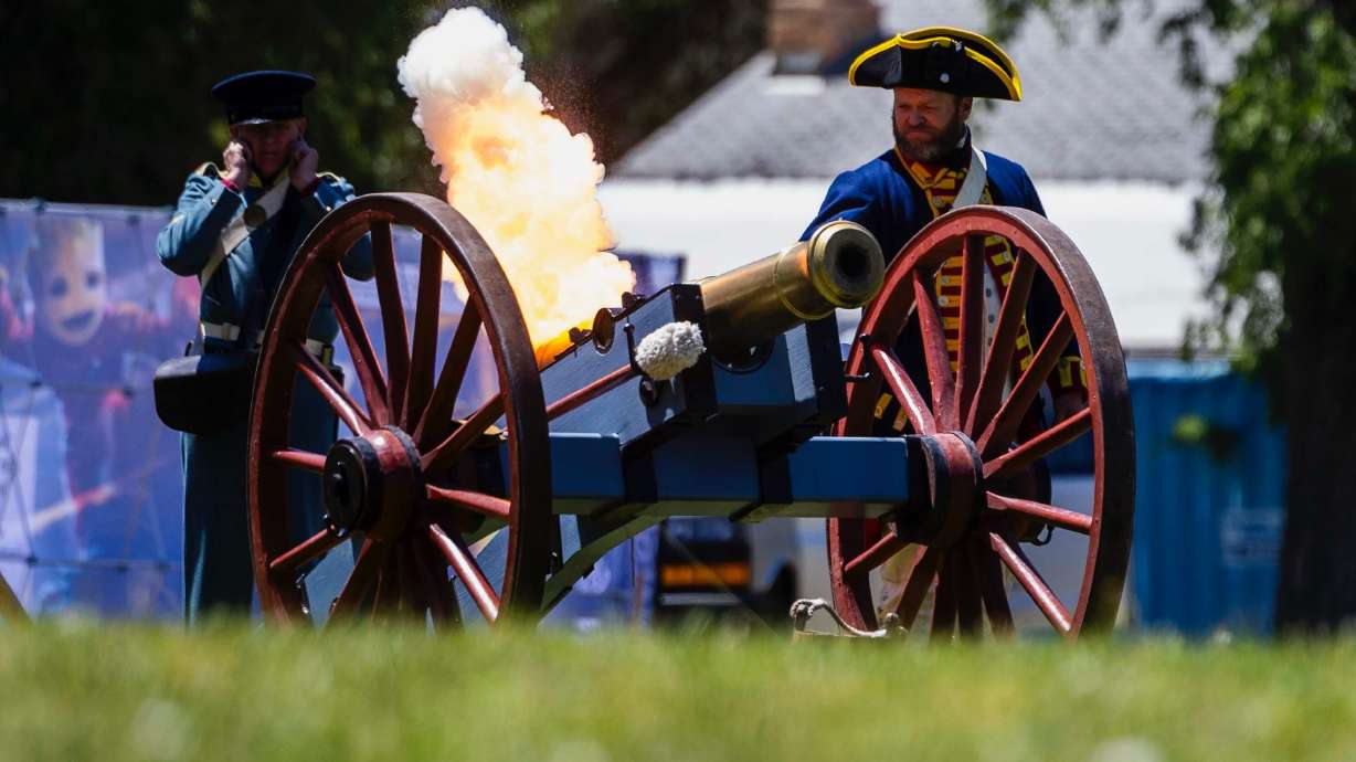 Jeremy Coates touches off a replica Revolutionary War cannon during a celebration of the U.S. Army’s 250th birthday at Fort Douglas in Salt Lake City on Saturday. The celebration was held as a massive military parade took place in Washington.