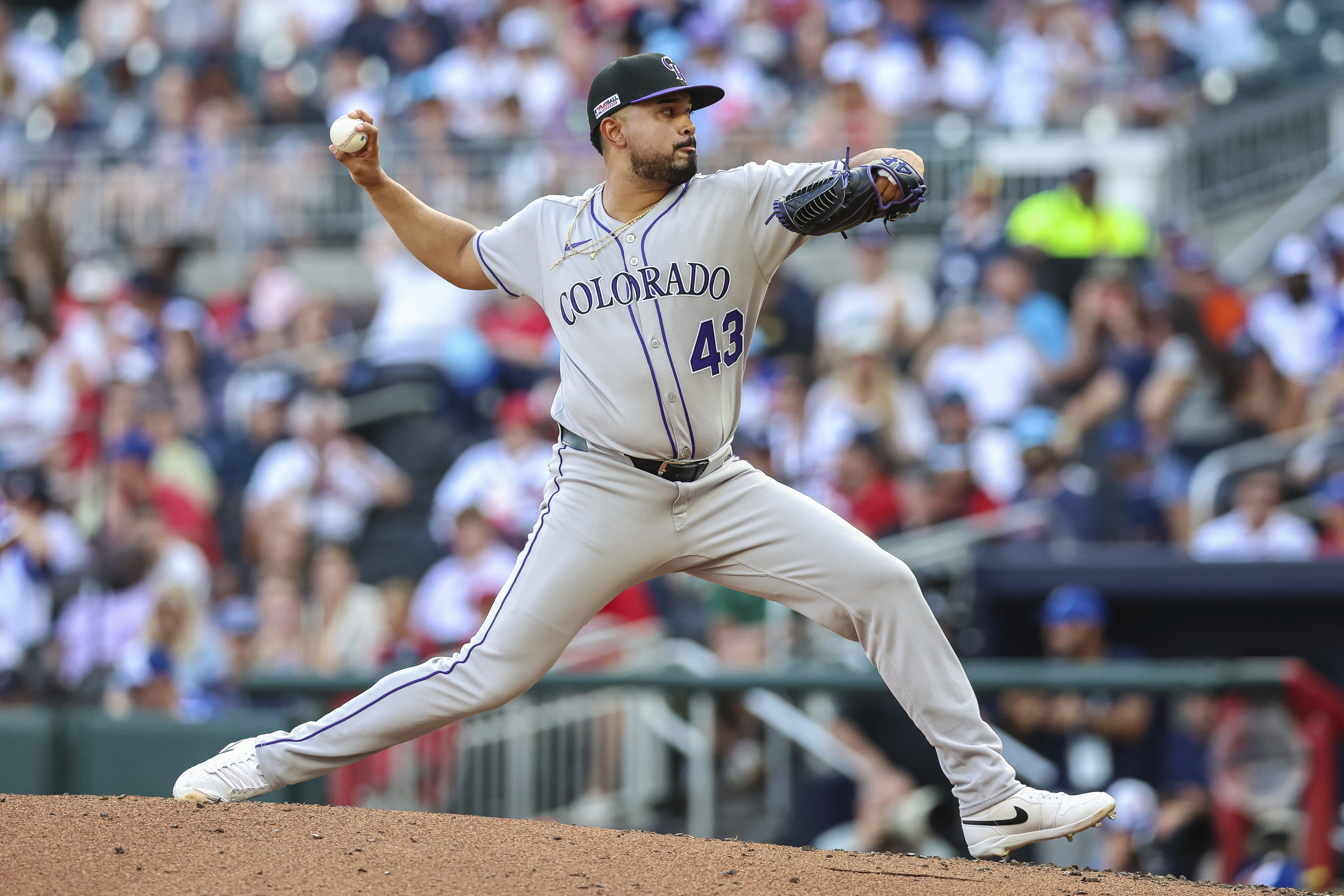 Colorado Rockies pitcher Anthony Molina (43) delivers in the eighth inning of a baseball game against the Atlanta Braves, Saturday, June 14, 2025, in Atlanta.