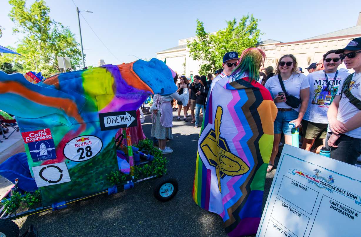 Members of "Raise Hell, Praise Whale!" meet with spectators and other teams on pit road before the Red Bull Soapbox Race in Salt Lake City on June 14. The team used "Out of the Blue" and its current mural for its kart design.