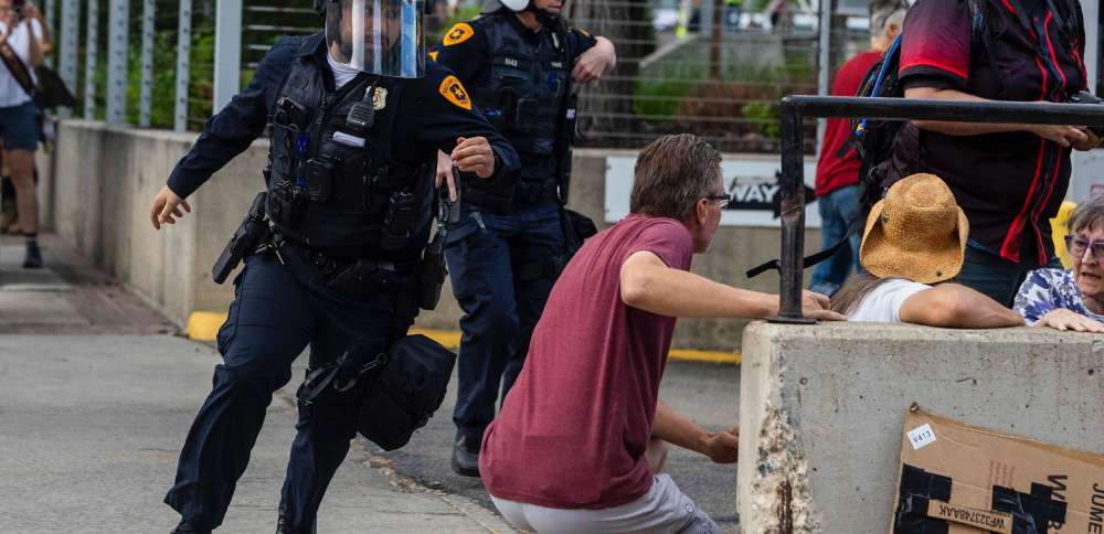 1 critically injured, 3 in custody following shooting during large march through SLC