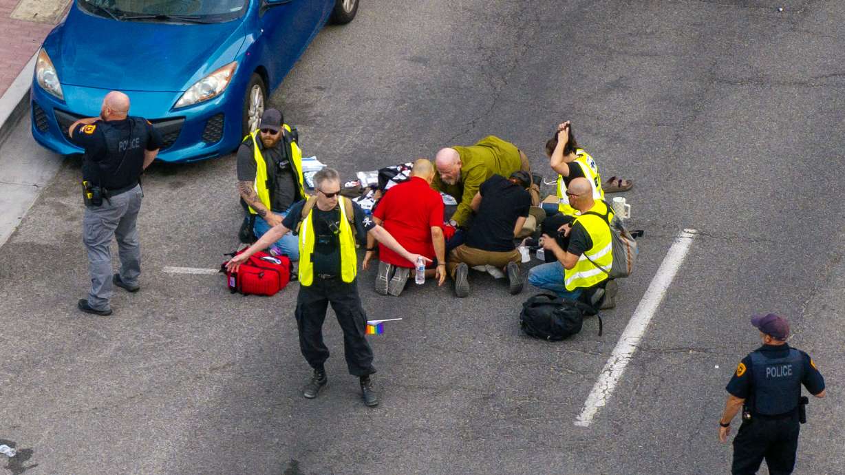 Police, medical personnel and "peacekeepers" swarm a man who was shot during the “No Kings” protest and march in Salt Lake City on Saturday. Police said Monday they are also investigating the role and actions of those peacekeepers.