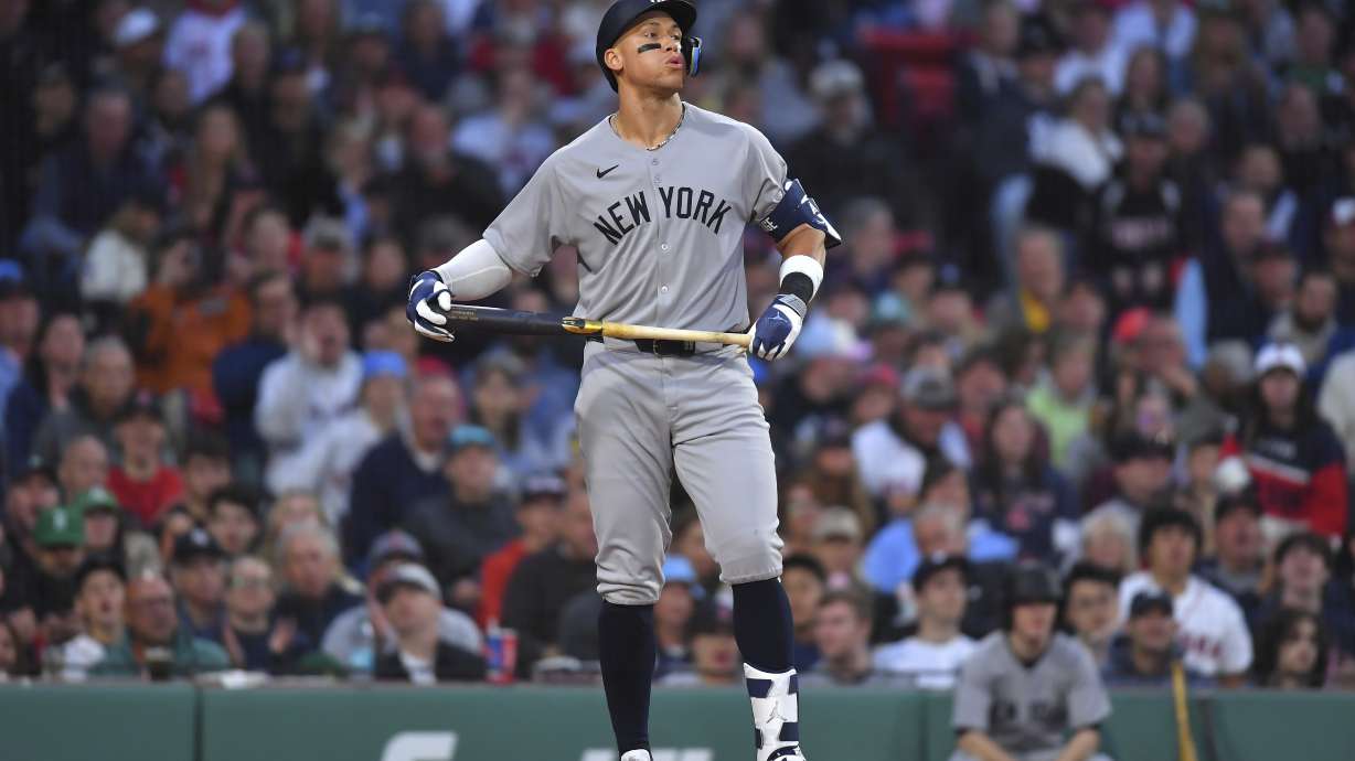 New York Yankees outfielder Aaron Judge reacts after he struck out swinging in the third inning of a baseball game against the Boston Red Sox, Saturday, June 14, 2025, in Boston.