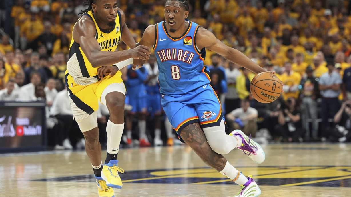 Oklahoma City Thunder forward Jalen Williams (8) drives as Indiana Pacers forward Aaron Nesmith defends during the second half of Game 4 of the NBA Finals basketball series, Friday, June 13, 2025, in Indianapolis.