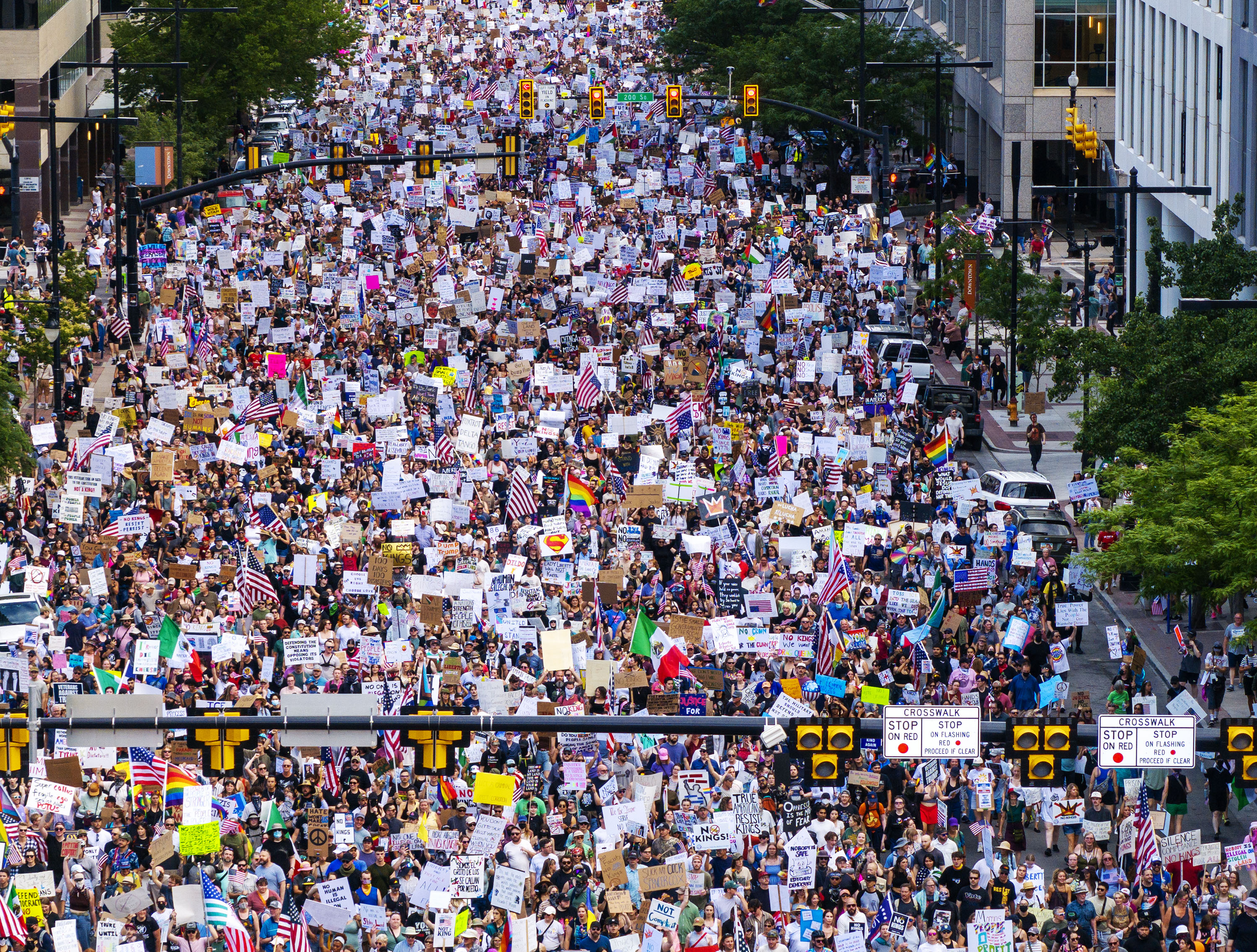 Protesters participate in a “No Kings” protest and march in Salt Lake City on Saturday. Arthur Folasa Ah Loo, 39, died Saturday after being shot during the protest and march in Salt Lake City on Saturday, police said.