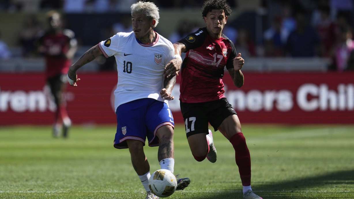 United States midfielder Diego Luna (10) brings the ball up the field against Trinidad and Tobago forward Rio Cardines (17) during the second half of a CONCACAF Gold Cup soccer match in San Jose, Calif., Sunday, June 15, 2025.