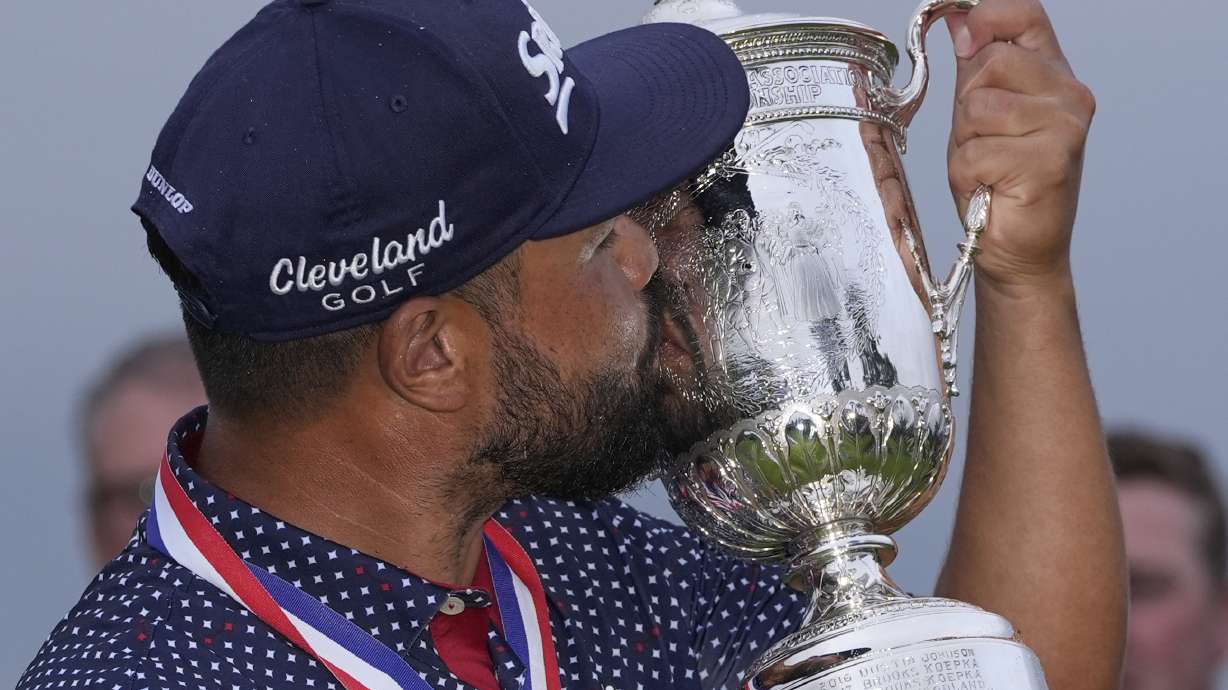 J.J. Spaun celebrates with the trophy after winning the U.S. Open golf tournament at Oakmont Country Club Sunday, June 15, 2025, in Oakmont, Pa.