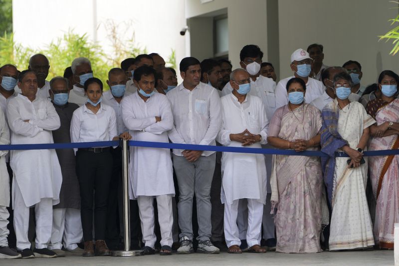 Political leaders gather to pay respect to the body of former Chief Minister of Gujarat Vijay Rupani, victim of Thursday's Air India plane crash, at a hospital in Ahmedabad, India, Monday.