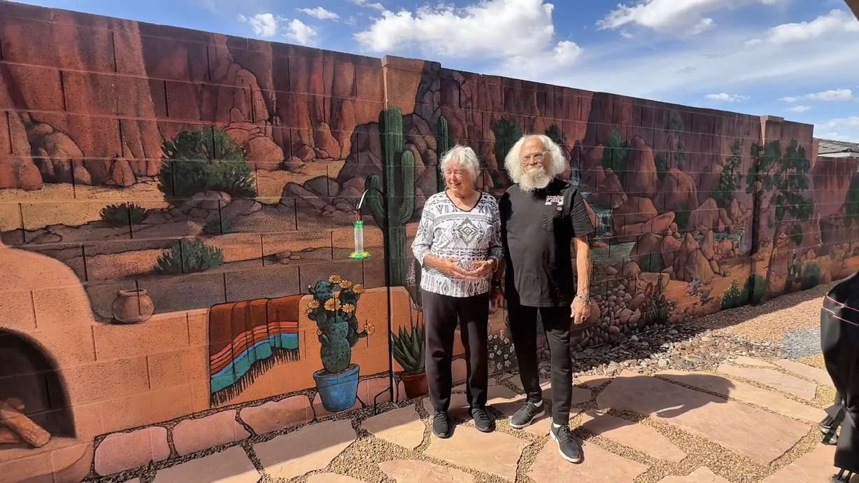 Patti Lewis, left, has been painting murals for over 45 years. She has more than 500 murals to her, name and she just finished her latest masterpiece in Hurricane, Washington County.