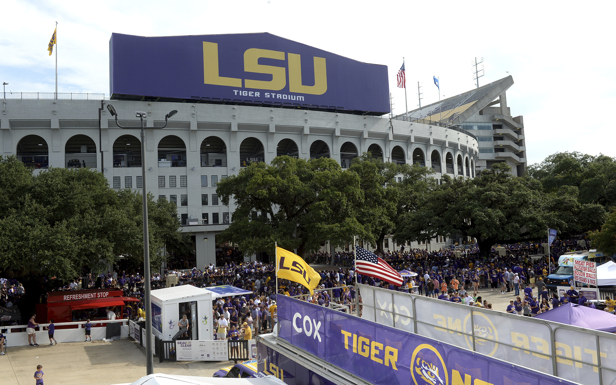 FILE - Preparations are made outside Tiger Stadium before an NCAA football game between LSU and Northwestern State in Baton Rouge, La, Sept. 14, 2019.