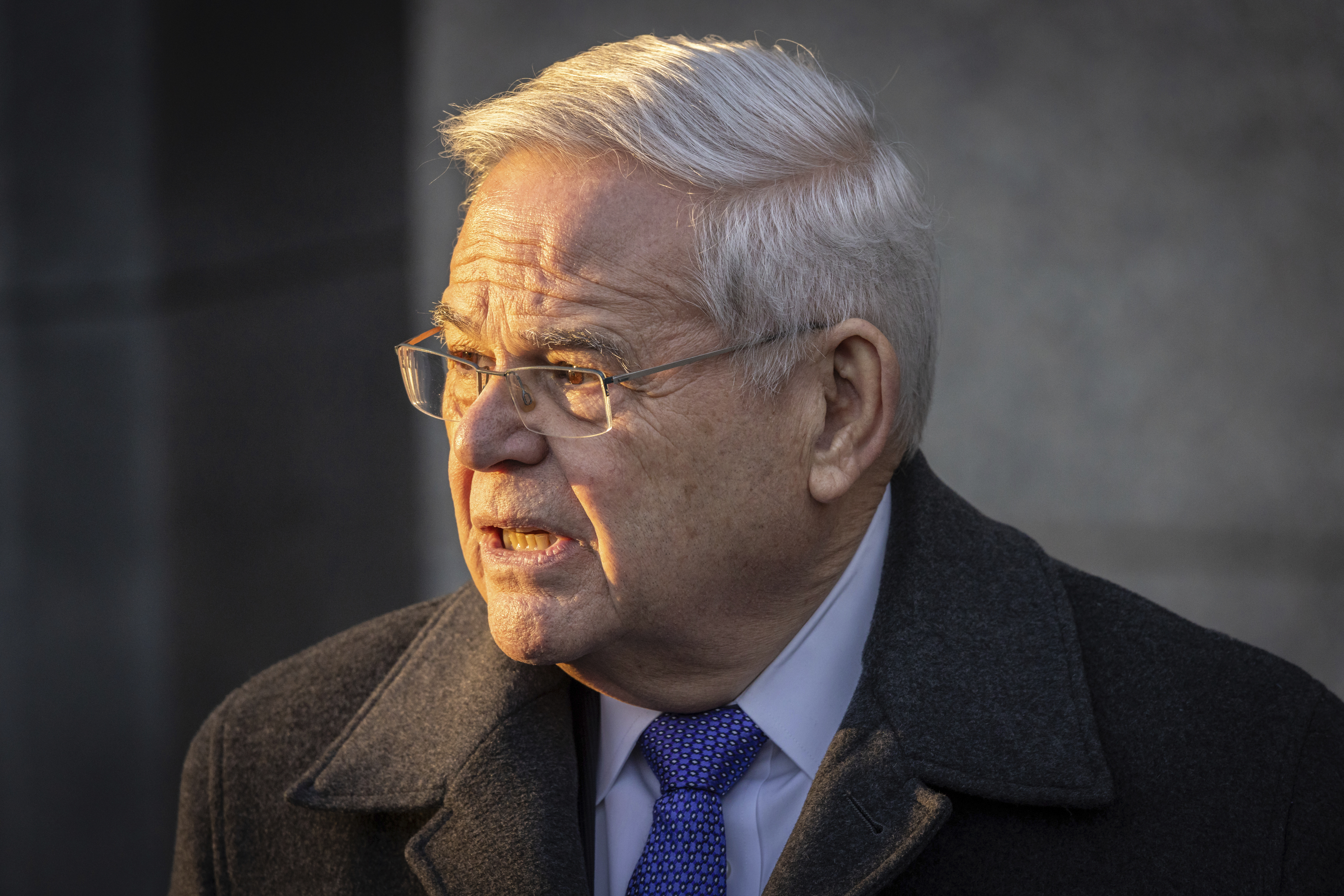 Former Sen. Bob Menendez, D-N.J., speaks to reporters outside federal court in New York, Jan. 29. Menendez arrived at a federal prison on Tuesday to begin serving an 11-year sentence.