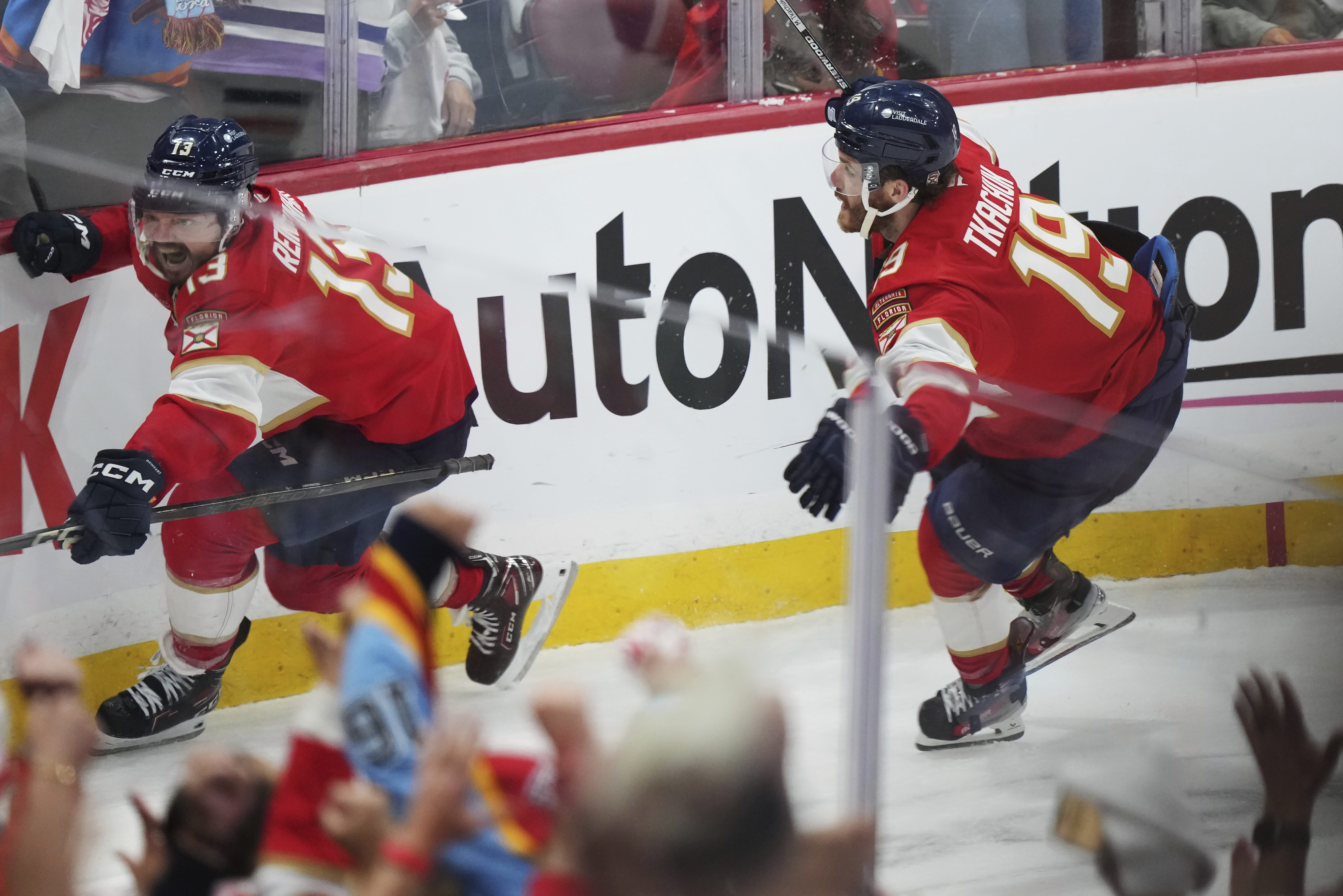 Florida Panthers' Sam Reinhart (13) celebrates after his goal against the Edmonton Oilers with teammate Matthew Tkachuk (19) during the third period in Game 4 of the NHL hockey Stanley Cup Final in Sunrise, Fla., Thursday, June 12, 2025.