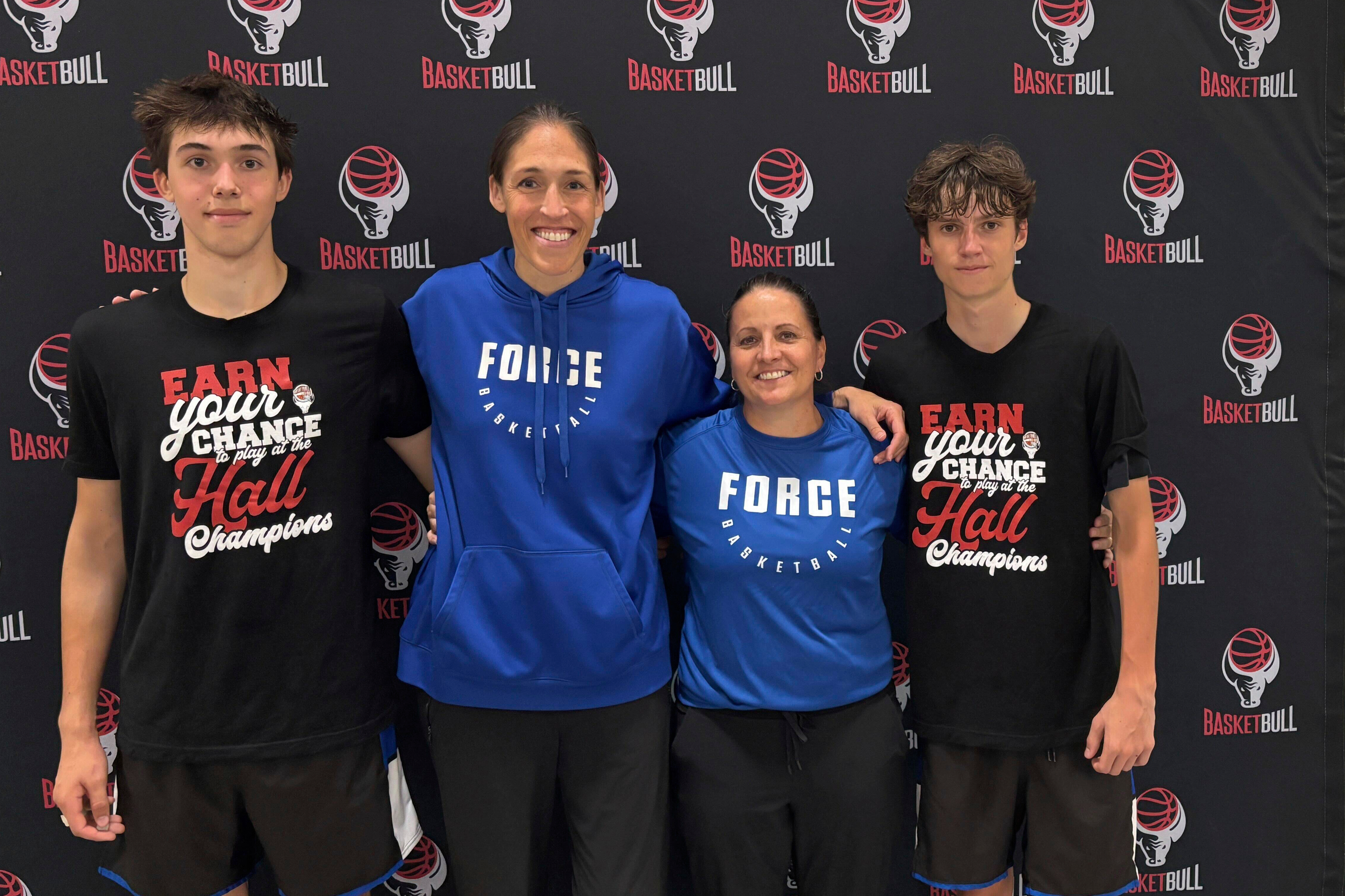 CT Force coach Rebecca Lobo, second from left, poses with her son Thomas, left, and fellow coach Jen Rizzotti, second from right, and Rizzotti's son Conor, right, after their team won an AAU Tournament basketball game against the G.O.S.H Warriors in Springfield, Mass, Sunday, June 15, 2025.