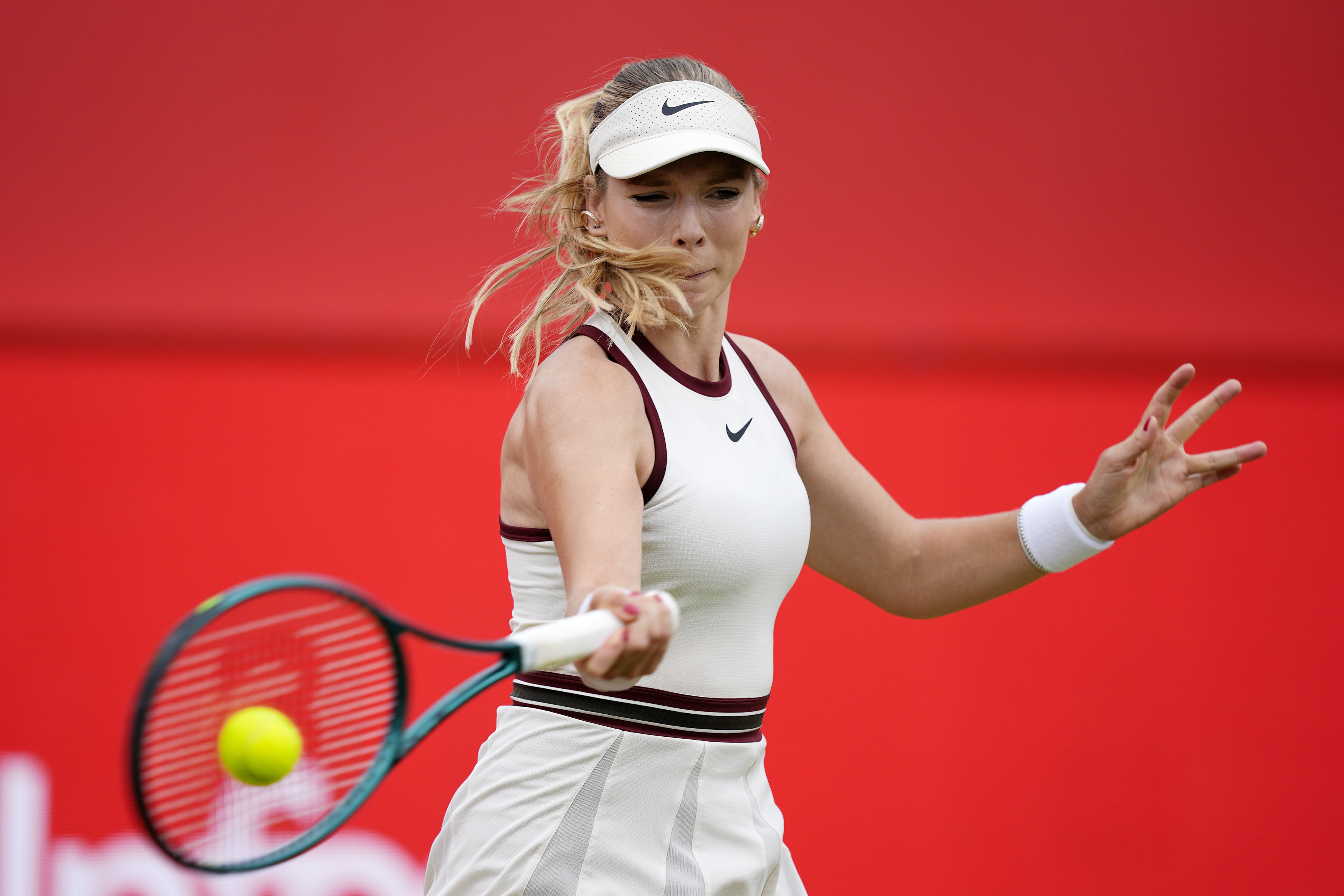 Katie Boulter returns the ball to Diana Shnaider during their match on day four of the HSBC Championships at The Queen's Club, in London, Thursday June 12, 2025.