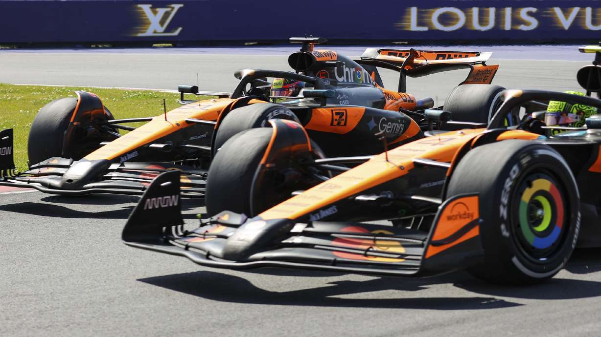 McLaren teammates Oscar Piastri, left, of Australia, and Lando Norris, right, of the United Kingdom, go wheel-to-wheel in the hairpin during the F1 Canadian Grand Prix auto race in Montreal, Sunday, June 15, 2025.