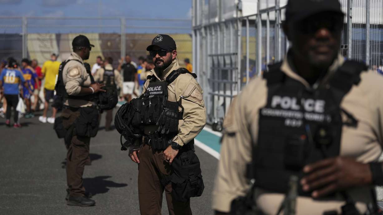 Law enforcement personnel stand outside the stadium prior to the Club World Cup group C soccer match between Boca Juniors and Benfica in Miami Gardens, Fla., Monday, June 16, 2025.