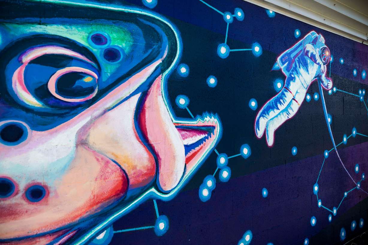 Part of Chris Peterson’s "Space Trout and Utopia Mural Project" in Salt Lake City on June 4. This mural of a trout about to swallow an astronaut helped Peterson gain recognition.