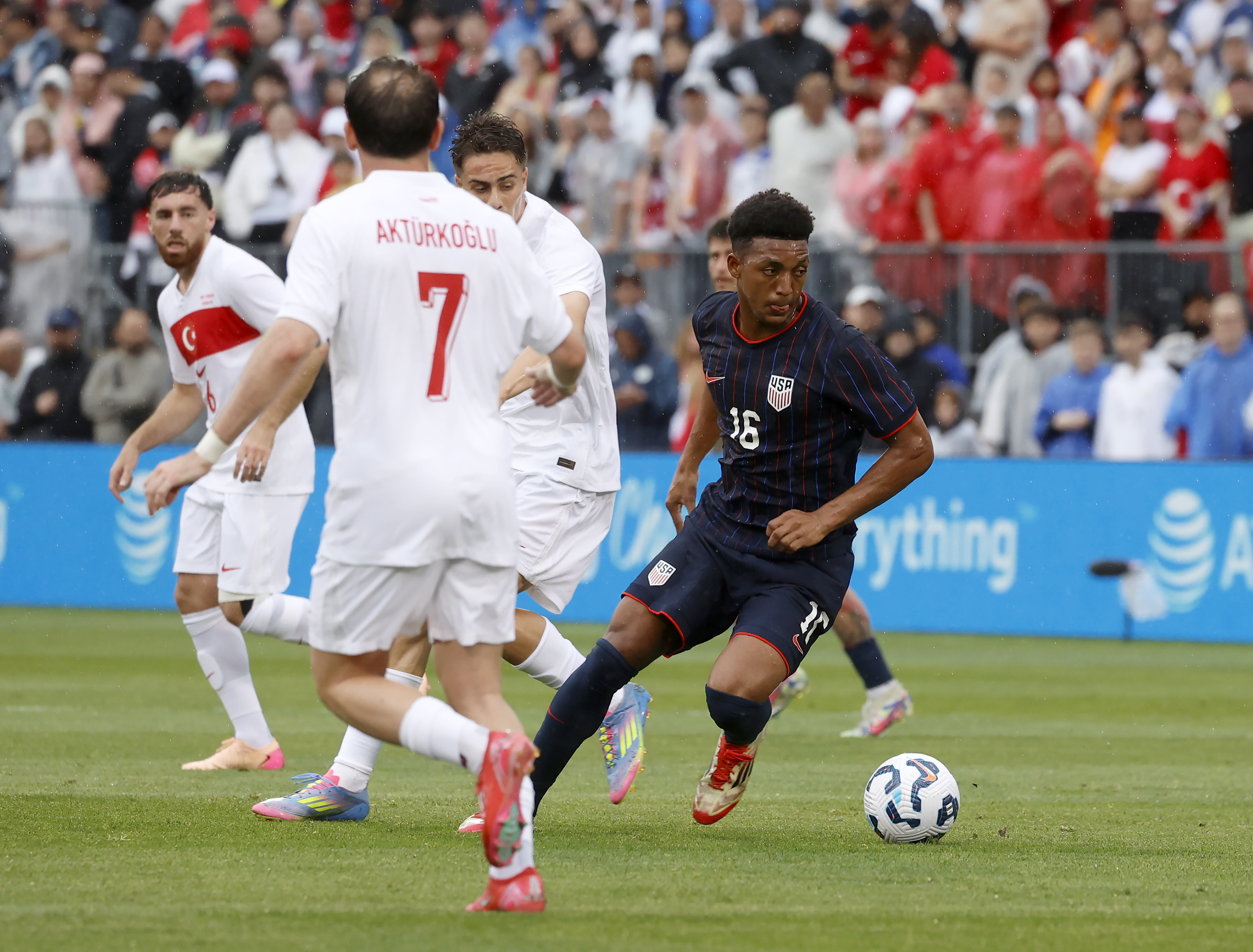 United States defender Alex Freeman (16) moves the ball past Turkey players including Kerem Aktürkoglu (7) during the first half of an international friendly soccer game, Saturday, June 7, 2025, in East Hartford, Conn.