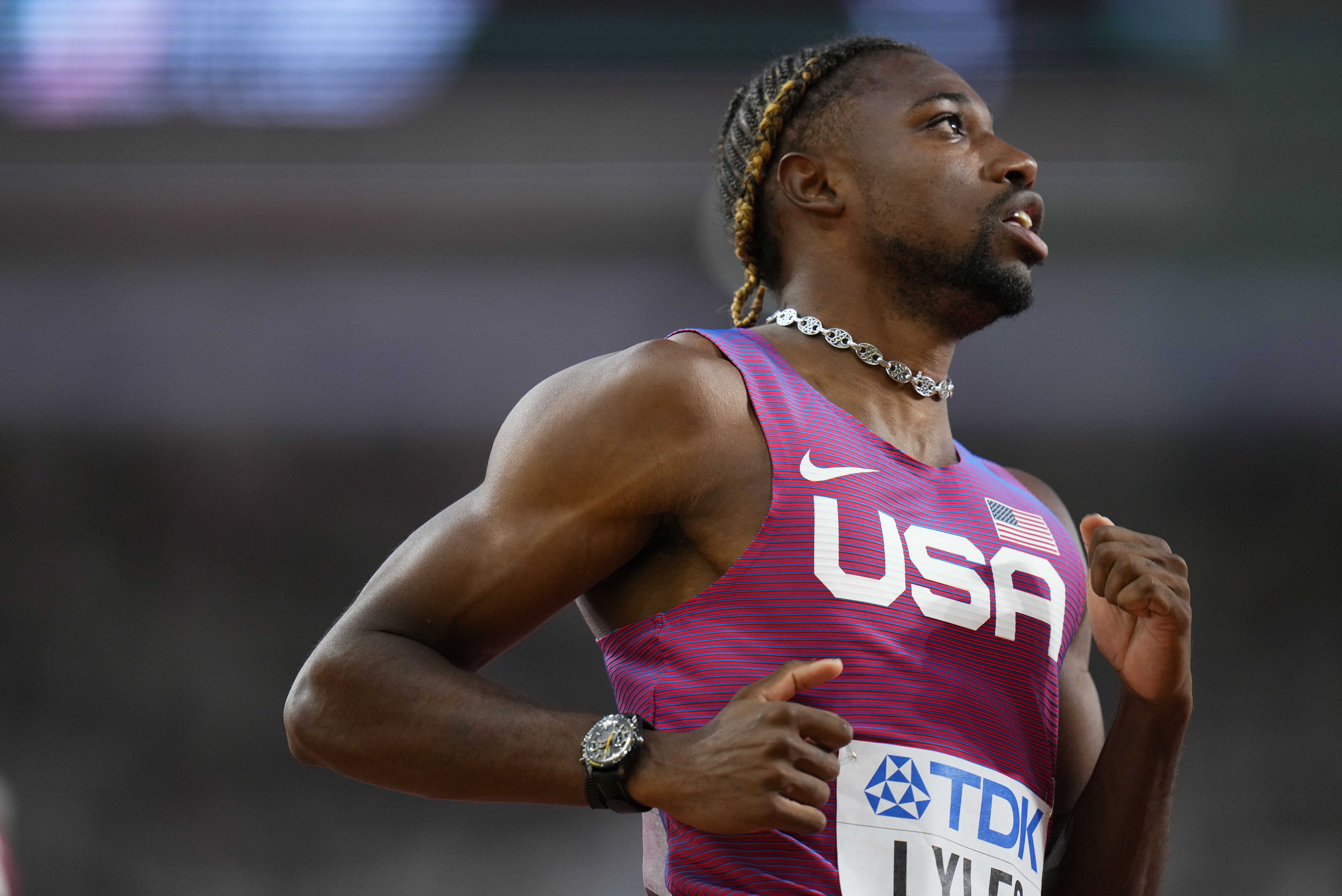 FILE - Noah Lyles, of the United States, slows down after winning a men's 100-meters heat during the World Athletics Championships in Budapest, Hungary, on Aug. 19, 2023.