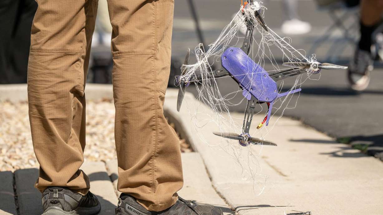 An employee holds a target drone as Fortem Technologies celebrates the opening of its advanced manufacturing headquarters in Lindon on Tuesday. Drones are continually viewed as the future technology of warfare.