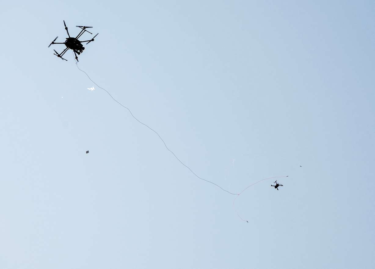 A DroneHunter fires a net in a demonstration flight at Fortem Technologies' opening of its advanced manufacturing headquarters in Lindon on Tuesday. The DroneHunter has been used worldwide to capture enemy drones of any size.
