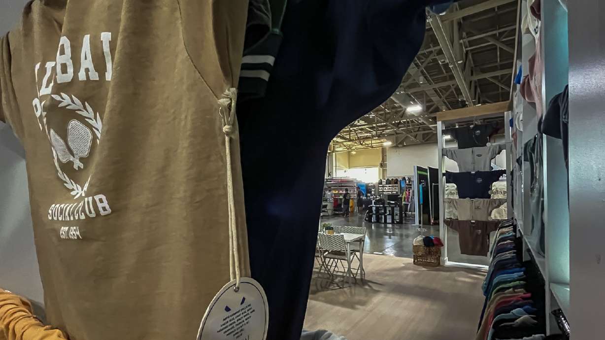 T-shirts on display while other vendors set up for Outdoor Retailer at Salt Palace Convention Center in Salt Lake City on Tuesday. The trade show runs through Friday.