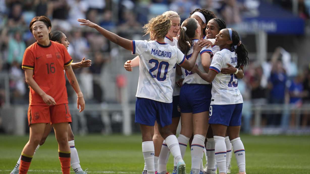 United States midfielder Sam Coffey (17), middle right, celebrates with teammates after scoring a goal during the first half of an international friendly soccer match against China, Saturday, May 31, 2025, in St. Paul, Minn.