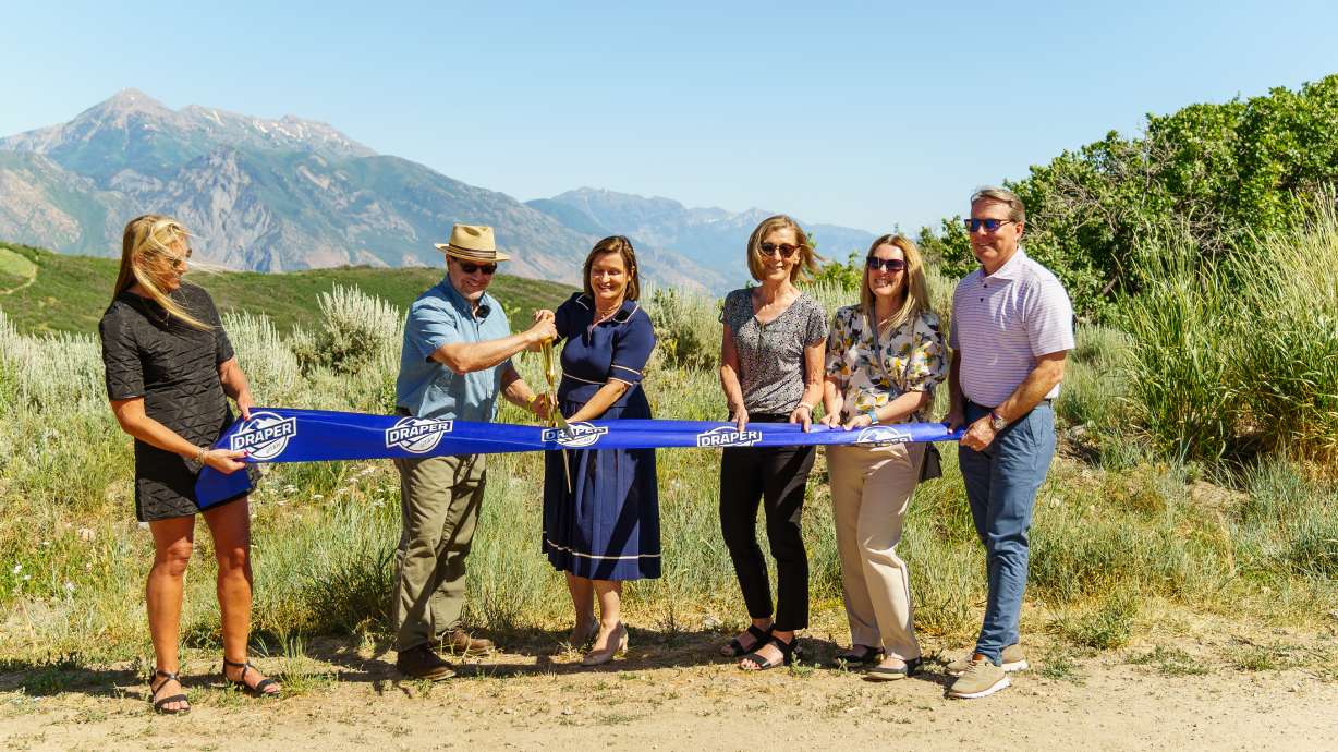 Draper and Salt Lake County officials cut a ribbon at Deer Ridge Trailhead on Tuesday, celebrating the addition of 255 acres of open space to the county's Traverse Range Conservation Easement.