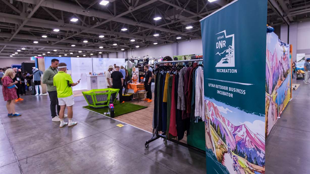 Representatives of six Utah businesses showcase their products at the Utah Outdoor Business Incubator booth set up for Outdoor Retailer at the Salt Palace Convention Center on Wednesday. The booth is a new feature debuting at this year's show.