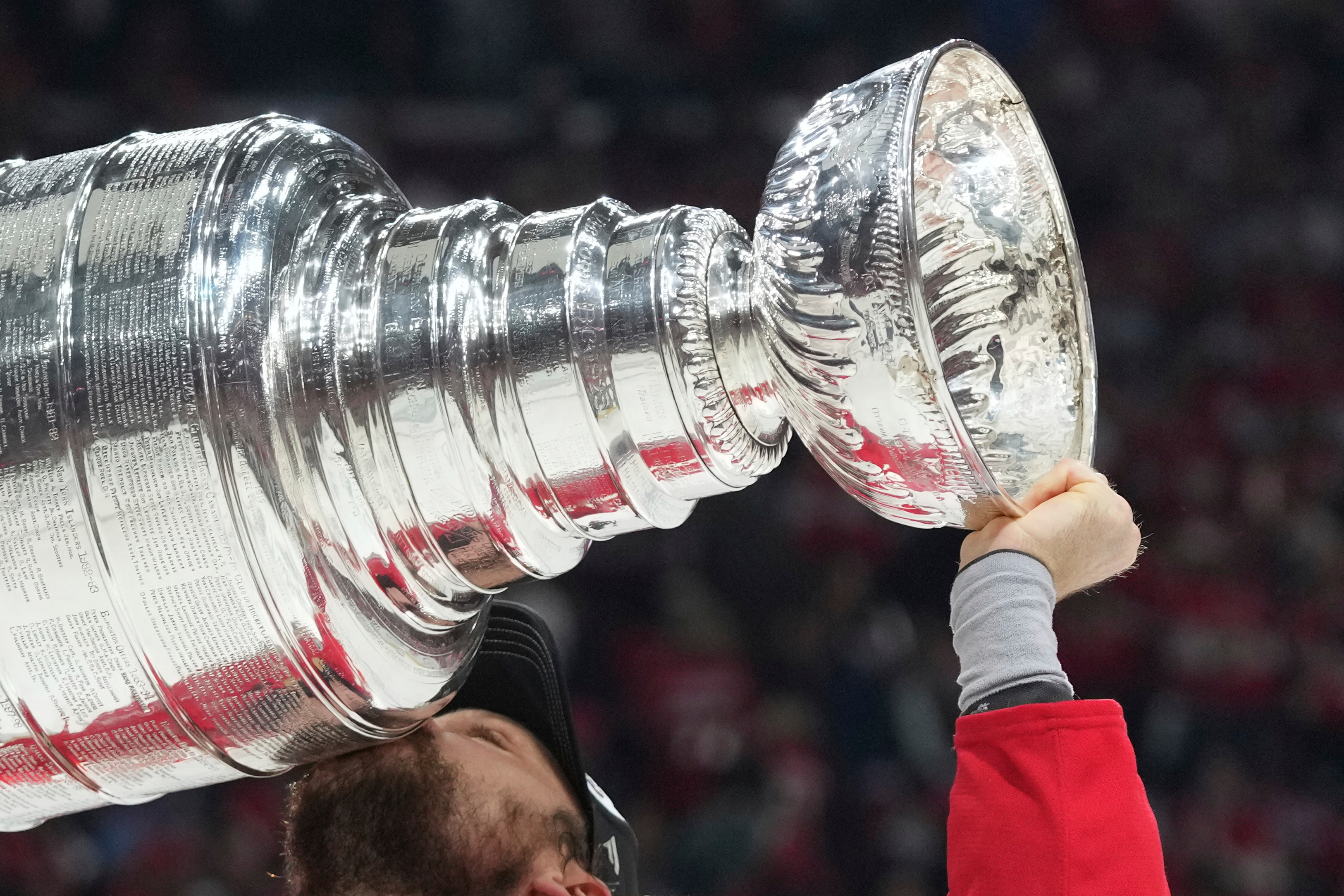 FILE - Florida Panthers center Sam Reinhart (13) kisses the Stanley Cup after defeating the Edmonton Oilers in Game 6 of the NHL hockey Stanley Cup Final Tuesday, June 17, 2025, in Sunrise, Fla.