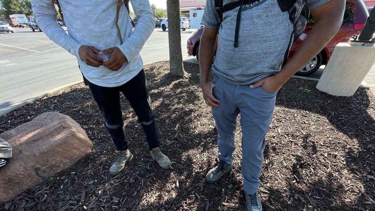 Two day laborers outside a big box store in Salt Lake County on Wednesday. They say they keep at it despite the threat of immigration enforcement action out of necessity.