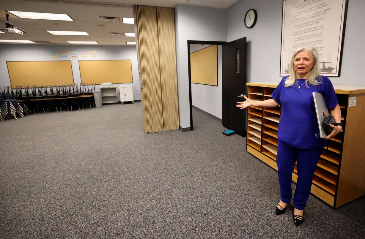 Carolyn Sharette, American Preparatory Academy superintendent, shows a classroom during a tour of the American Preparatory Academy Draper 1 campus in Draper on Wednesday. The Legislature's Education Interim Committee members visited the facility on Wednesday.
