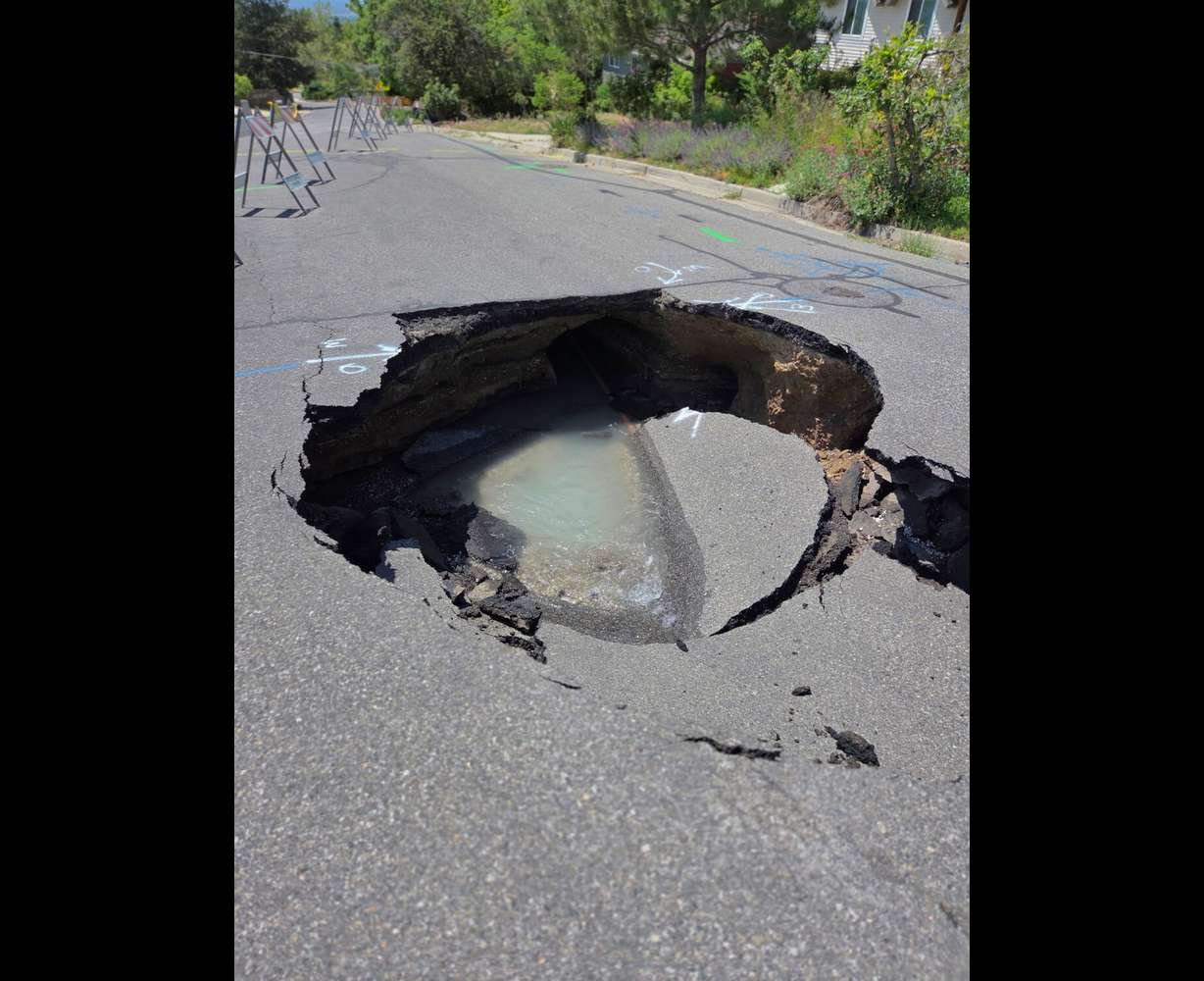 A sinkhole is pictured on Nila Way in Holladay. Two sinkholes have appeared in the area in the past two weeks.