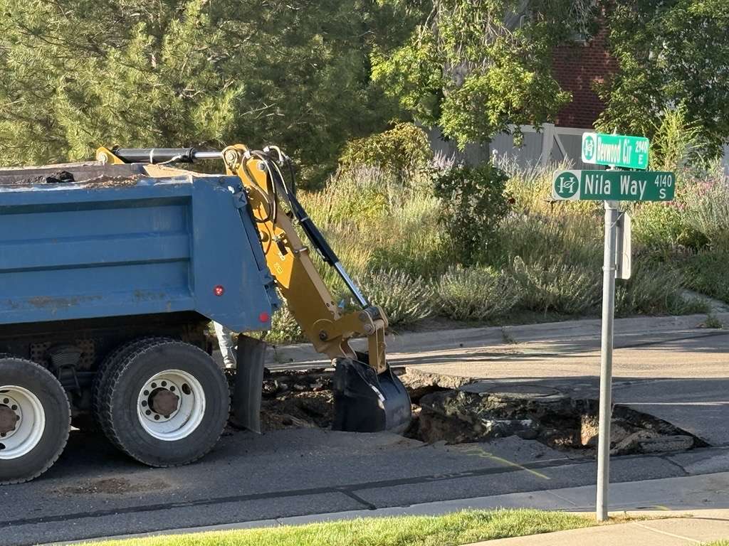 Crews work to repair a sinkhole on Nila Way in Holladay on Wednesday. This is the second sinkhole in this area in two weeks.