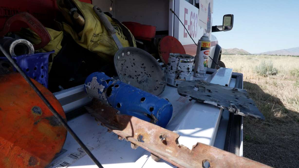 Firefighters display steel targets and a propane tank that can easily start wildfires when used in target shooting, Wednesday in Tooele.